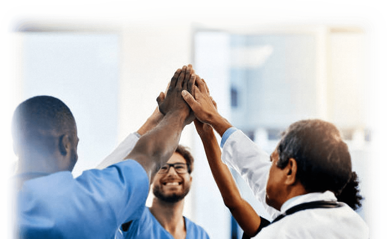 Doctors smiling in success after IME claims are approved.